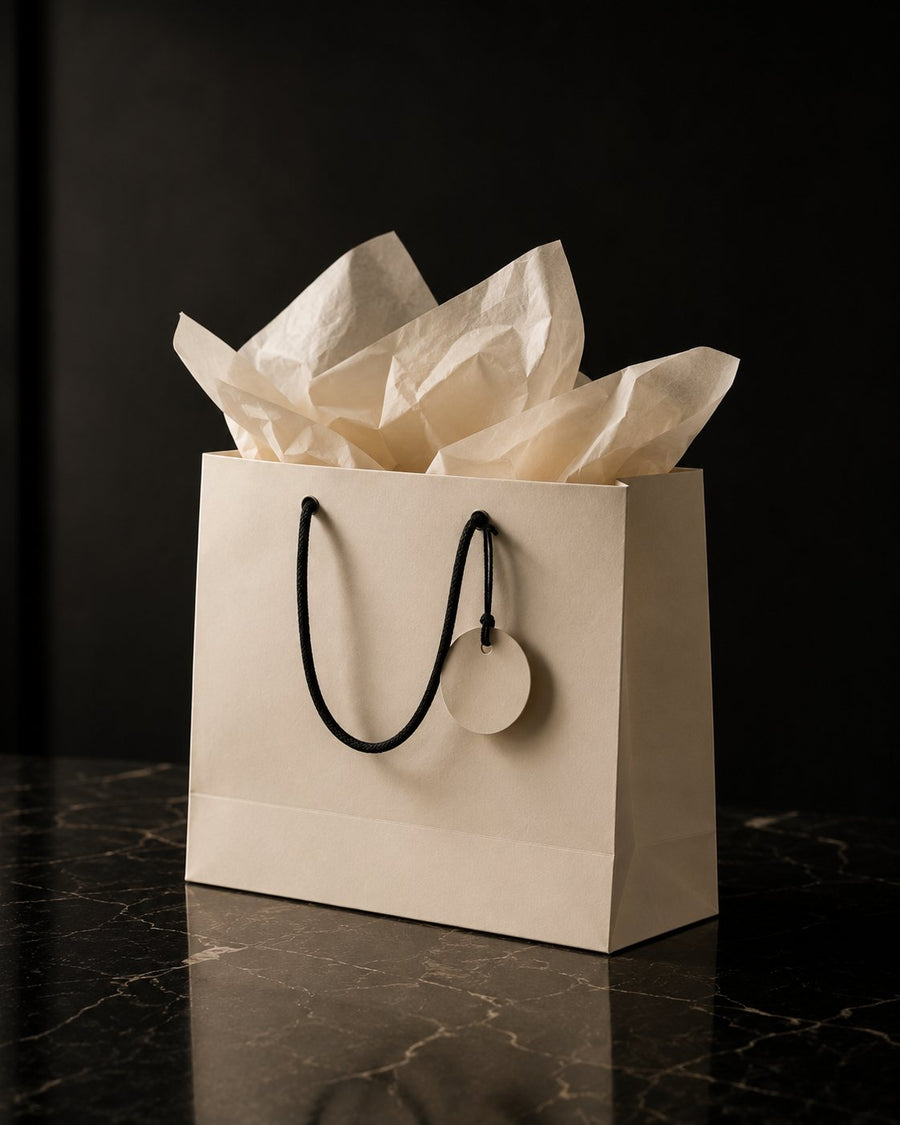 A cream shopping bag with tissue and a round tag