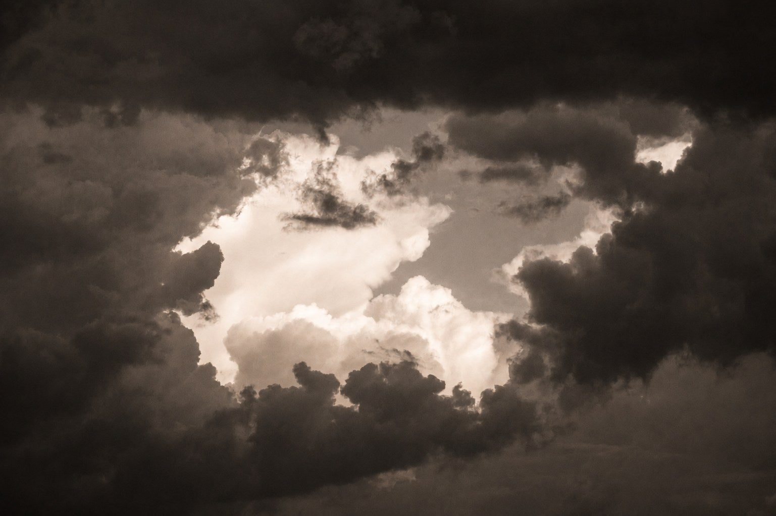 Warm light breaking through dark cloud